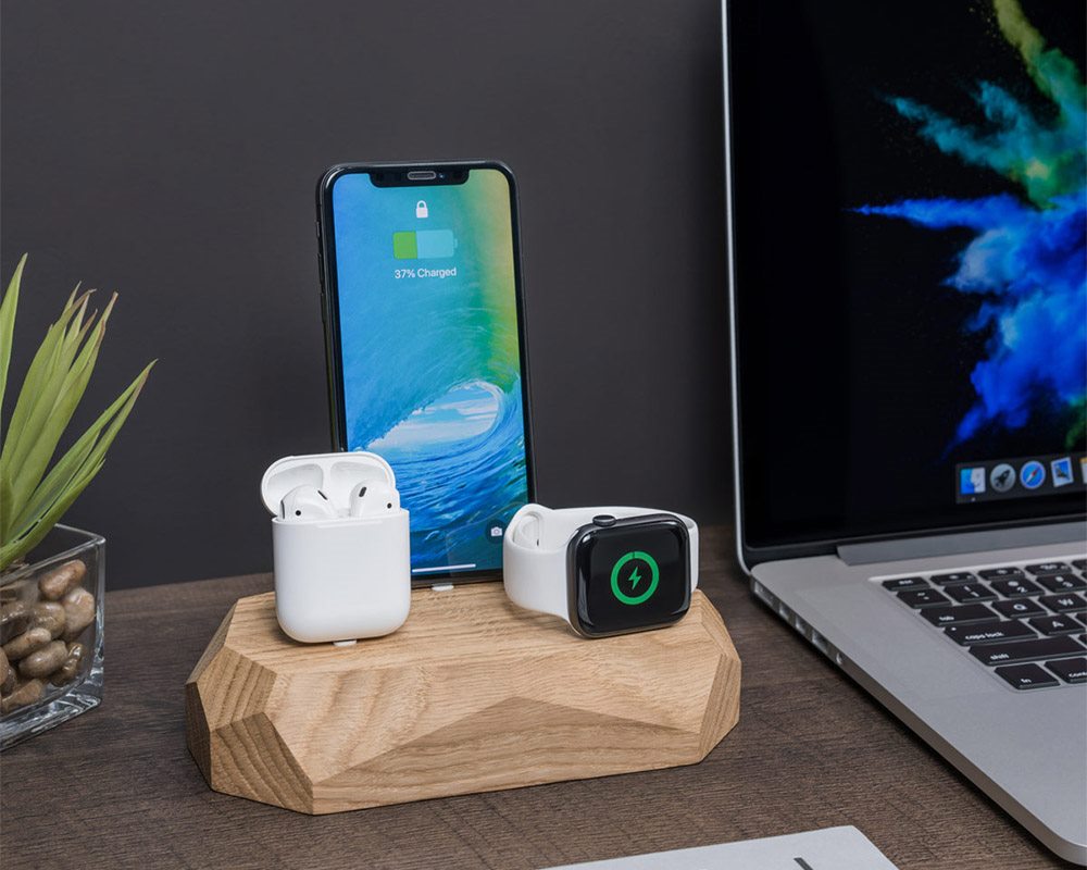 wooden charging dock with Apple devices