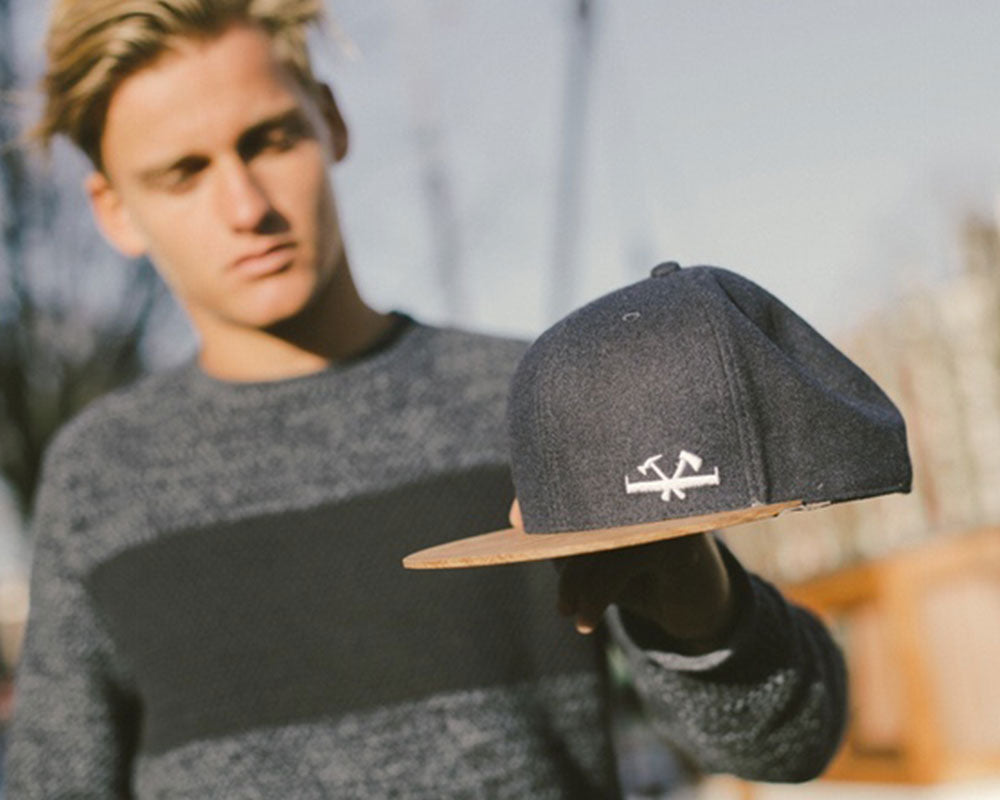 two o caps with wooden brim on wooden amsterdam webshop