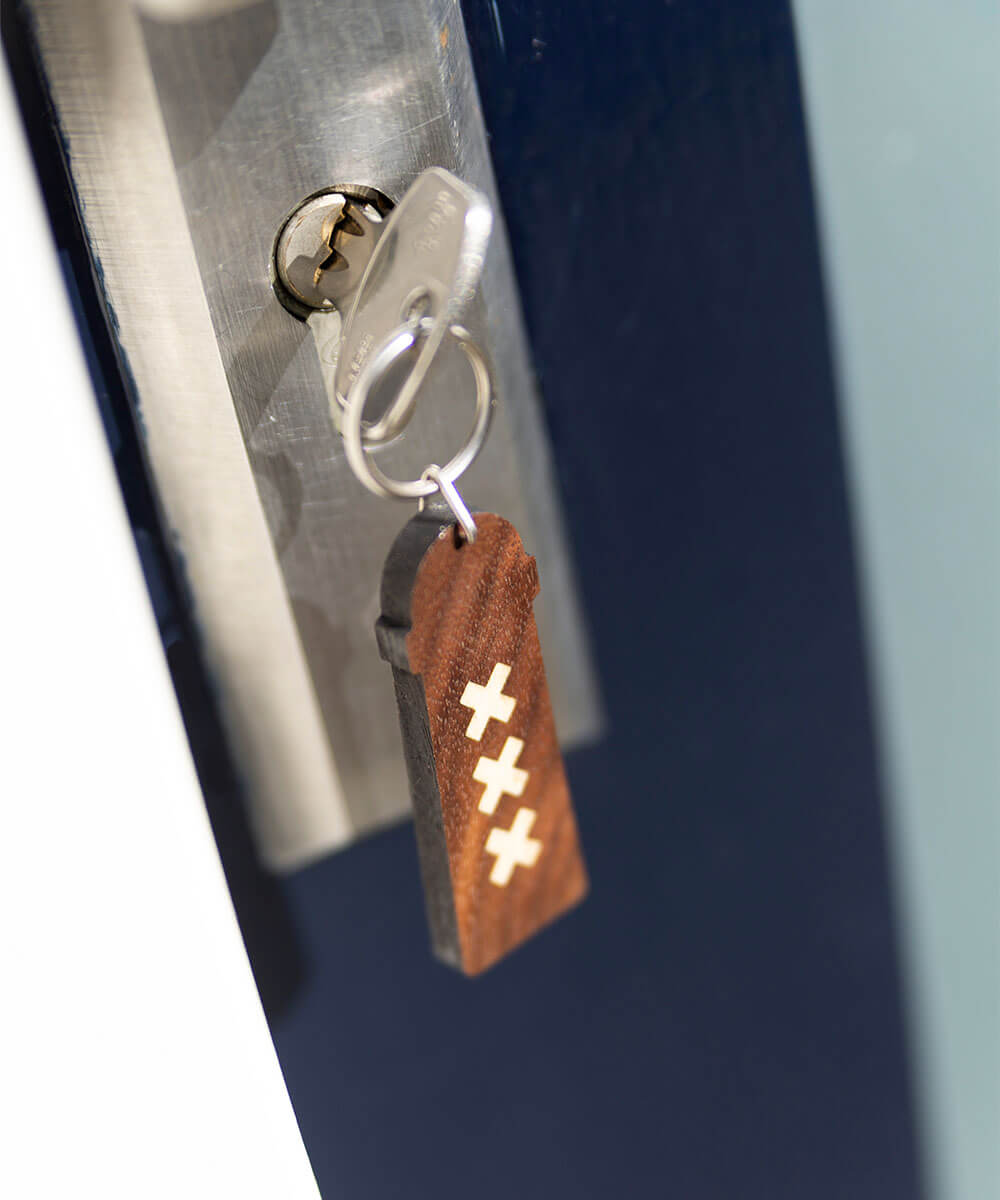 wooden keychain amsterdammertje with key on webshop wooden amsterdam.jpg