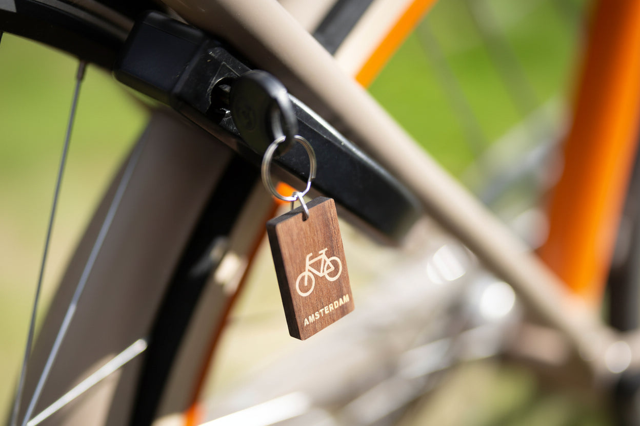 wooden keychain bicycle with key on webshop wooden amsterdam.jpg